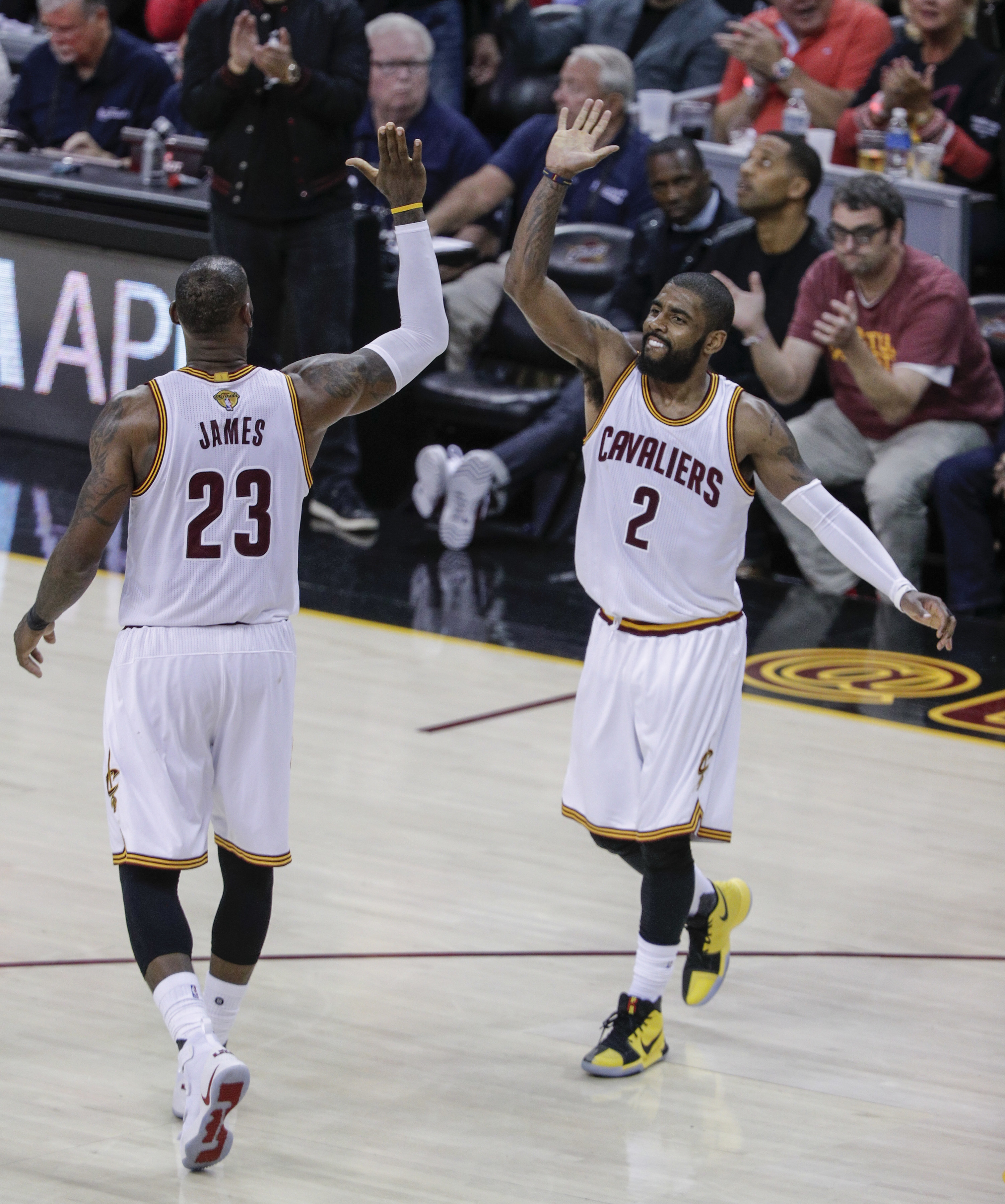 Cleveland Cavaliers&#x27; LeBron James and Kyrie Irving high five