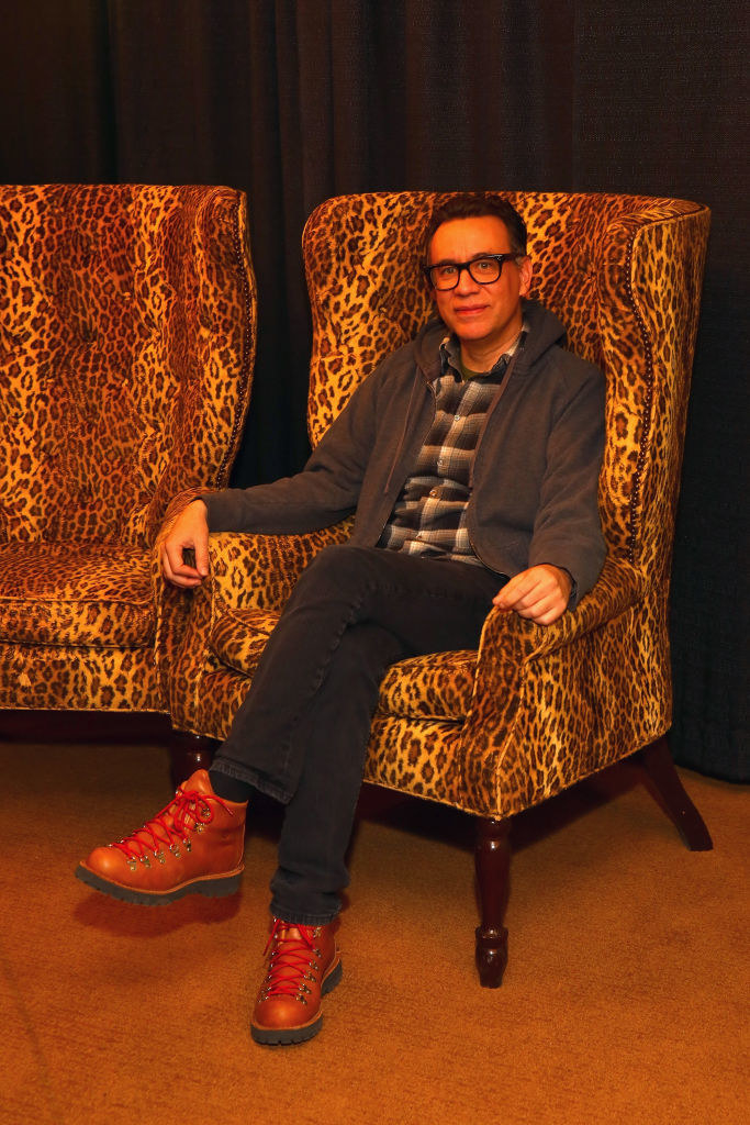 Fred sitting in an animal-print chair