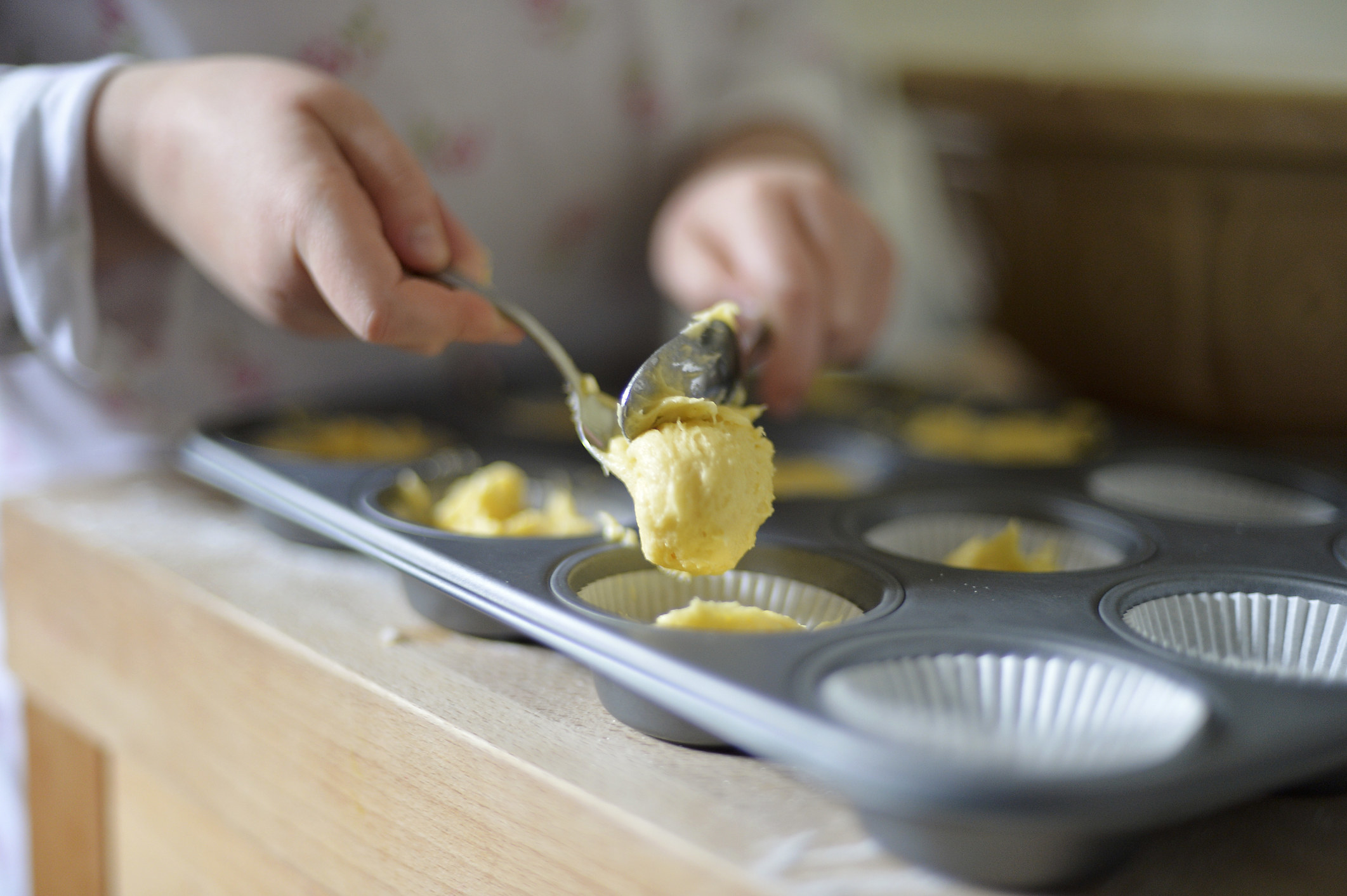 A person making muffins