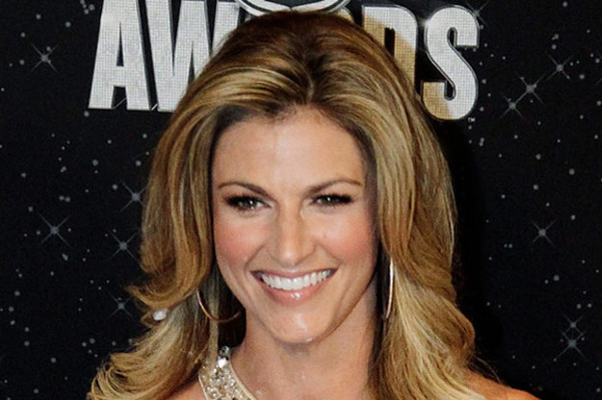 Fox Sports Network broadcaster Erin Andrews, left, embraces New