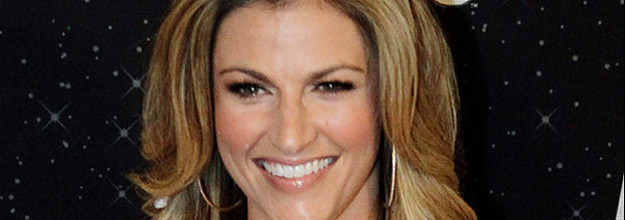 Fox Sports Network broadcaster Erin Andrews, left, embraces New