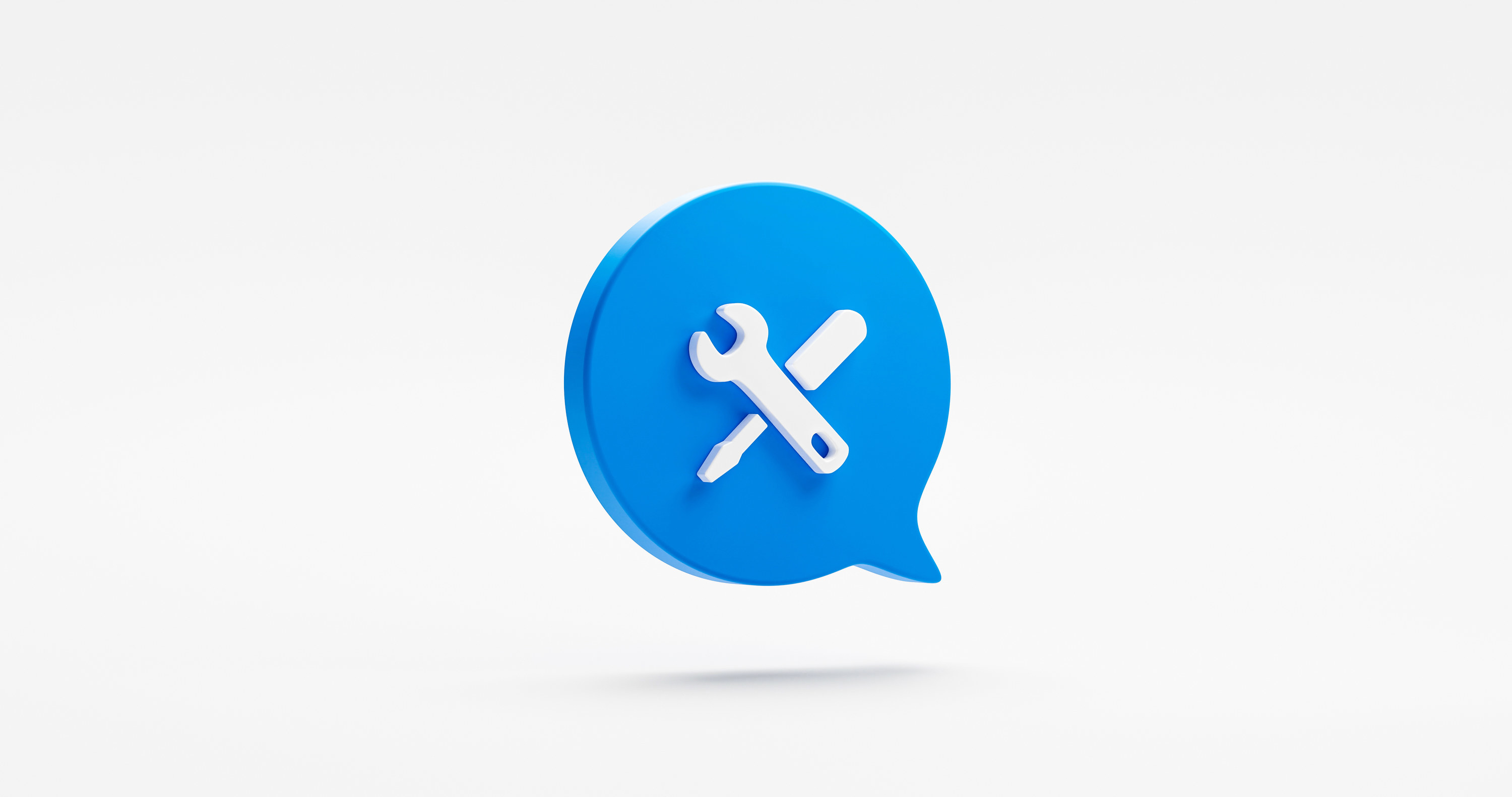 a blue speech bubble icon with a white screwdriver and spanner in it