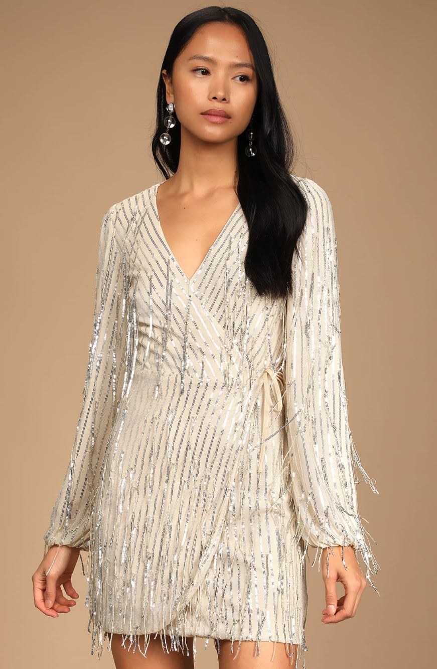 model wearing beige long sleeve sequin dress