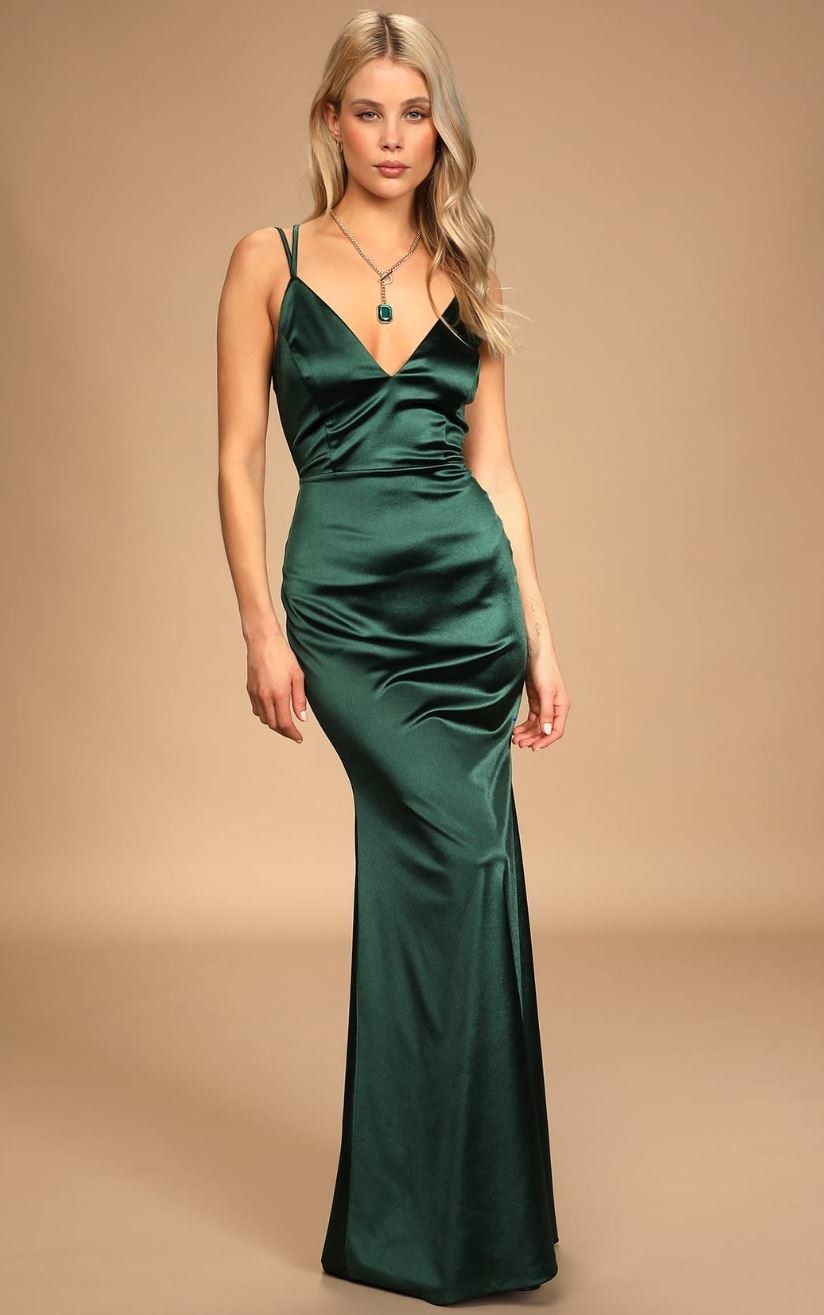 model wearing emerald green maxi dress
