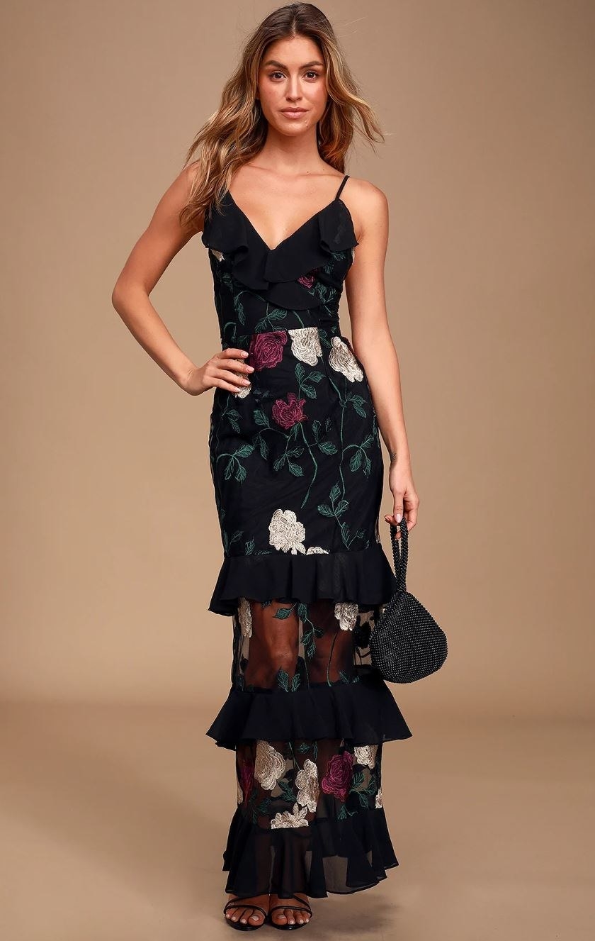 model wearing black floral maxi dress