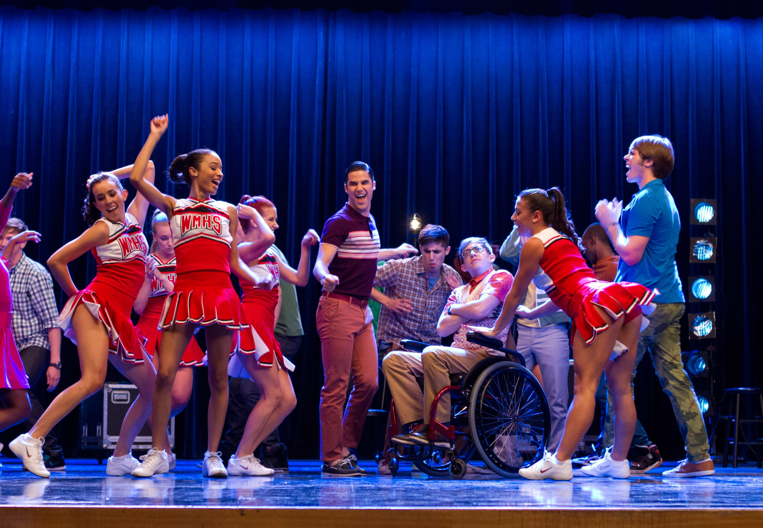 the characters dancing on stage