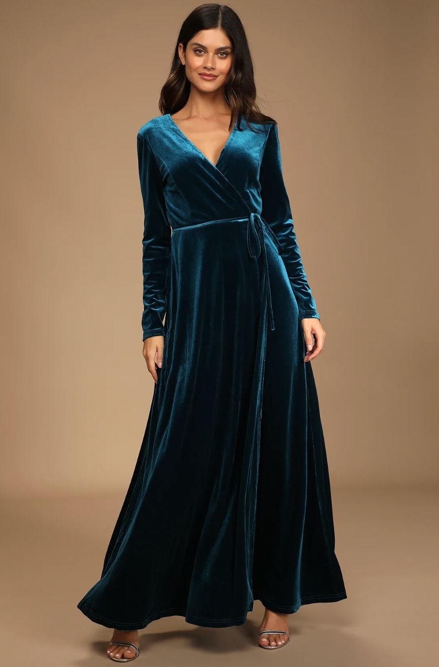 model wearing turquoise velvet maxi dress