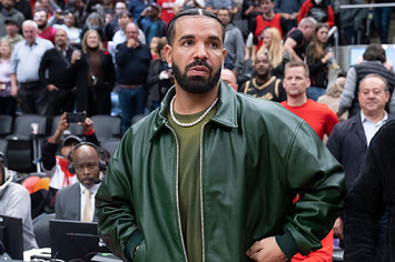 Drake gets up from his seat after the Toronto Raptors defeated the Chicago Bulls at the Scotiabank Arena