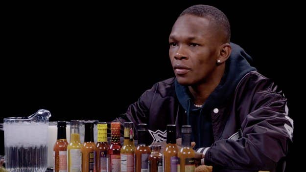 On 'Hot Ones,' MMA fighter Israel Adesanya broke down how anime has inspired him and what movie best showcases what it means to be a fighter.