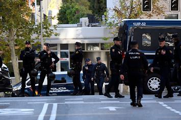 Spanish police stand guard near the United States Embassy in Madrid on Thursday