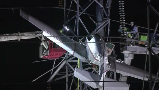 The pilot and the passenger were both rescued hours after the plane crashed into a power line tower, causing the small craft to become entangled in wires.