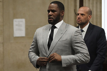 R. Kelly stands in court before Judge Lawrence Flood at Leighton Criminal Court Building