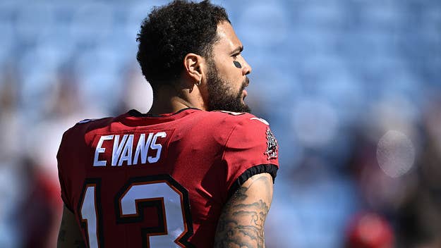 A pair of NFL officials are under investigation after a video surfaced of them appearing to ask Tampa Bay Buccaneers wide receiver Mike Evans for his autograph.