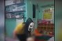A daycare worker is seen wearing a creepy mask