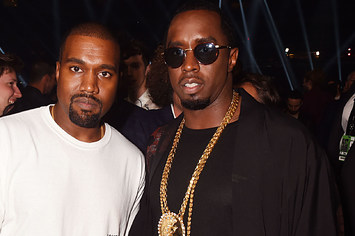 Kanye West and Sean Diddy Combs pose backstage