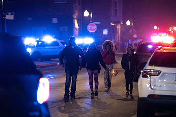 Police investigate the scene where as many as 14 people were shot on Oct. 31, 2022 in Chicago, Illinois