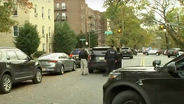 Two Newark police officers were shot and wounded by an unknown gunman firing from atop a building Tuesday afternoon, as the pair of cops were serving a warrant