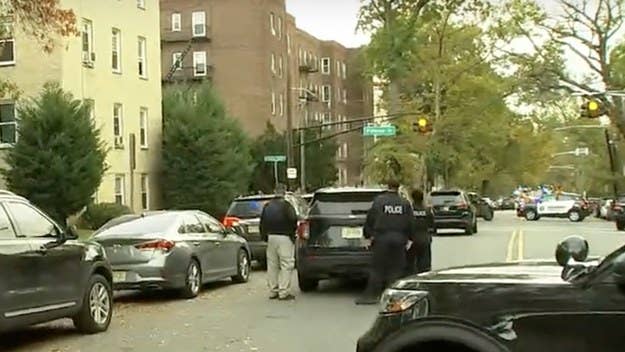 Two Newark police officers were shot and wounded by an unknown gunman firing from atop a building Tuesday afternoon, as the pair of cops were serving a warrant