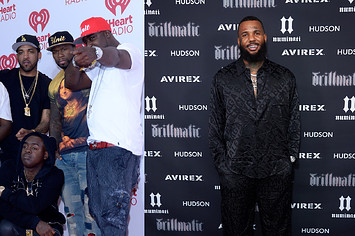G-Unit in a group photo alongside a photo of former member The Game
