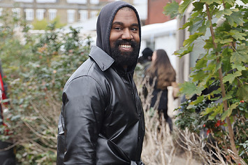 Ye is seen wearing a leather jacket and hoodie