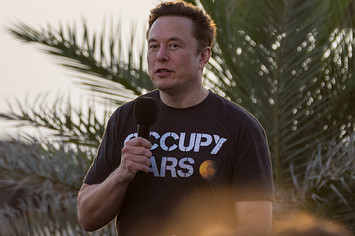 Elon Musk is pictured in a Mar shirt