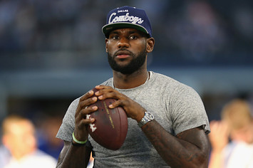 Lebron James throws a football at AT&T Stadium before Giants and Cowboys game.