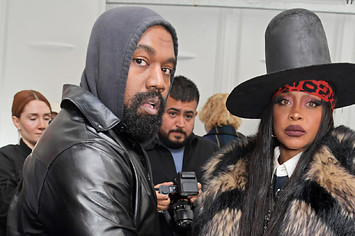 Kanye West and Erykah Badu pose backstage at the Burberry Spring/Summer 2023 runway show