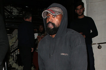 Kanye wearing a hat facing left