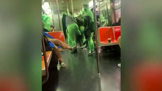 The footage was captured this past weekend and shows a group of unidentified individuals, all in green bodysuits, on a New York City subway.