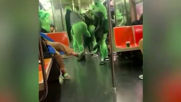The footage was captured this past weekend and shows a group of unidentified individuals, all in green bodysuits, on a New York City subway.