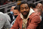 John Wall #1 of the Houston Rockets reacts prior to tip off against the Atlanta Hawks at State Farm Arena