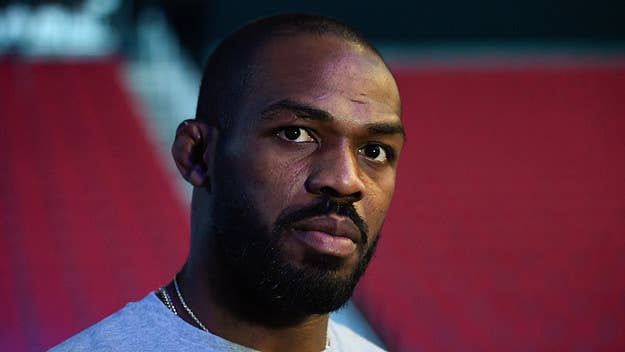Jon Jones posts surveillance footage where he was in pursuit of an alleged burglar with a shotgun in his hand outside of his home.
