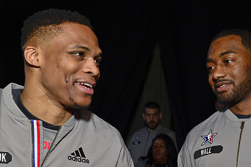 Russell Westbrook #0 of the Western Conference All Star Team talks to John Wall.