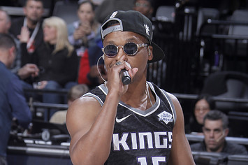 Lupe Fiasco performs during the game