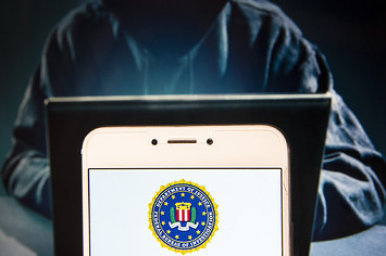 In this photo illustration, the Federal Bureau of Investigation Police (FBI) logo