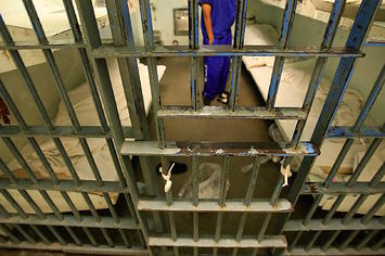An inmate in a six bunk cell inside the Men's Central Jail