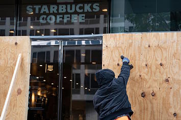 Wooden boards protect a Starbucks location near the White House