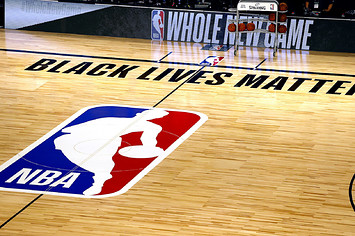 An overview of the basketball court shows the NBA logo and Black Lives Matter.