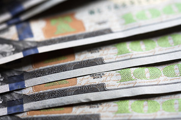 A photo illustration of US 100 dollar bills.