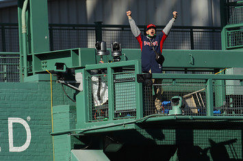 A man wearing a Red Sox jersey