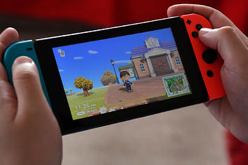 Someone playing 'Animal Crossing: New Horizons' on Switch