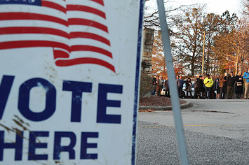 Voters wait in line to cast ballot at polling station setup in St Thomas Episcopal Church.