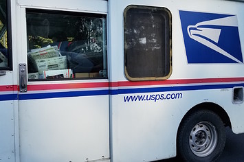 Close up of the side of a United States Postal Service (USPS) delivery truck