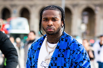 Pop Smoke, wearing a blue Off White coat, is seen outside the Off White show.