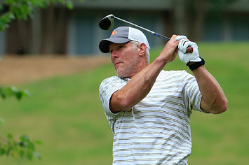 Brett Favre hits his drive on the 12th hole