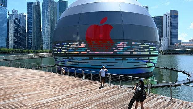 The futuristic-looking globe, named Apple Marina Bay Sands, lights up at night and sits on Singapore's water-front as a part of a hotel complex.