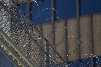 Razor wire is seen on the Metropolitan Detention Center prison