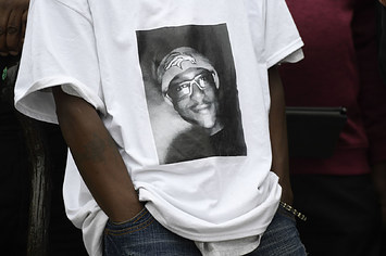 LaWayne Mosley, father of Elijah McClain, wears a t shirt with is son's picture on it.