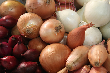 Onions and shallots lie on display at the 2018 International Green Week