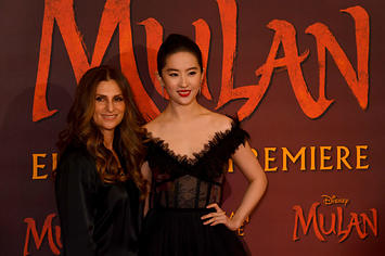 Niki Caro and Yifei Liu attend the "Mulan" photocall.